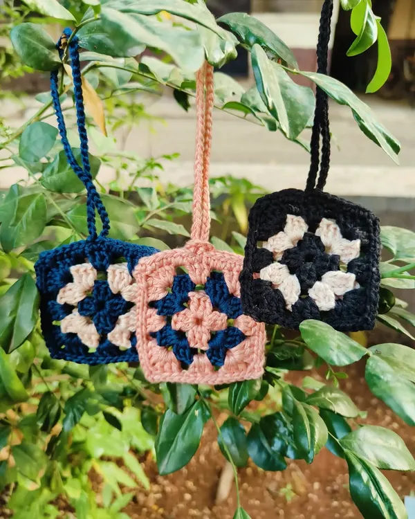Keep your Airpods safe from scratches with our handmade crochet cases. This photo shows our popular granny square design, available in multiple color combinations.