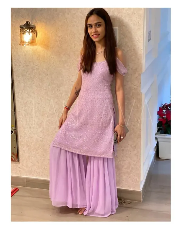 Lilac has my heart. My client Poovi looks lovely in this custom lilac sharara set with delicate embroidery and cold-shoulder sleeves, which she wore for her housewarming party.