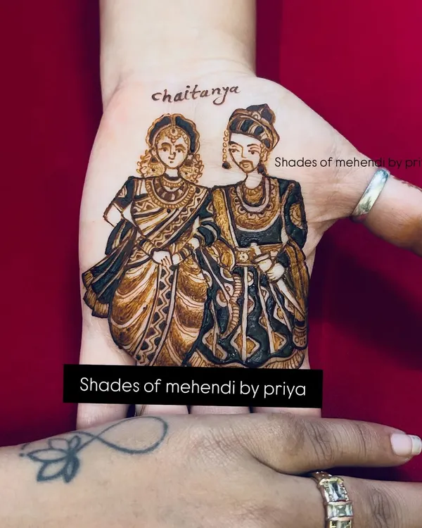 A custom couple portrait for an engagement, featuring the name 'Chaitanya'. I work closely with clients to capture their likeness and traditional attire, making their mehendi truly personal.