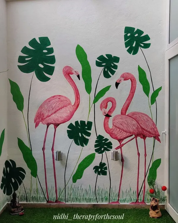 The completed flamingo mural brings a splash of color and tropical fun to this balcony, creating a perfect backdrop for relaxing or entertaining.