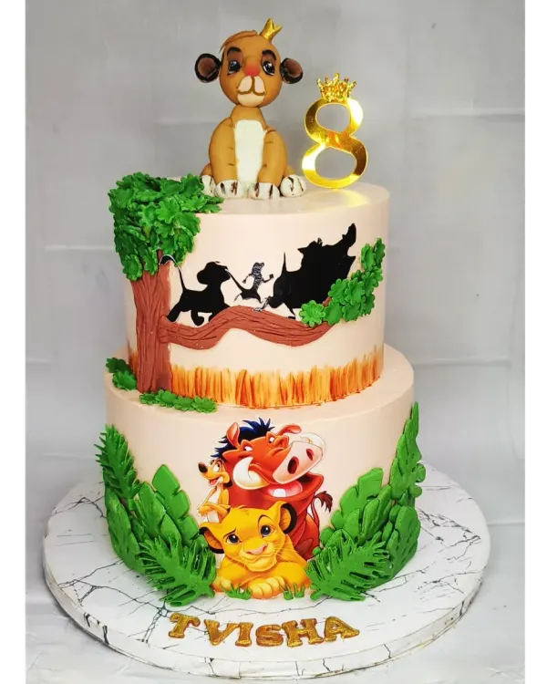 This two-tier Lion King cake is a true showstopper, combining choco-vanilla flavors with detailed scenes from the movie. The handmade fondant Simba on top and the silhouette designs make it a memorable centerpiece for an 8th birthday.