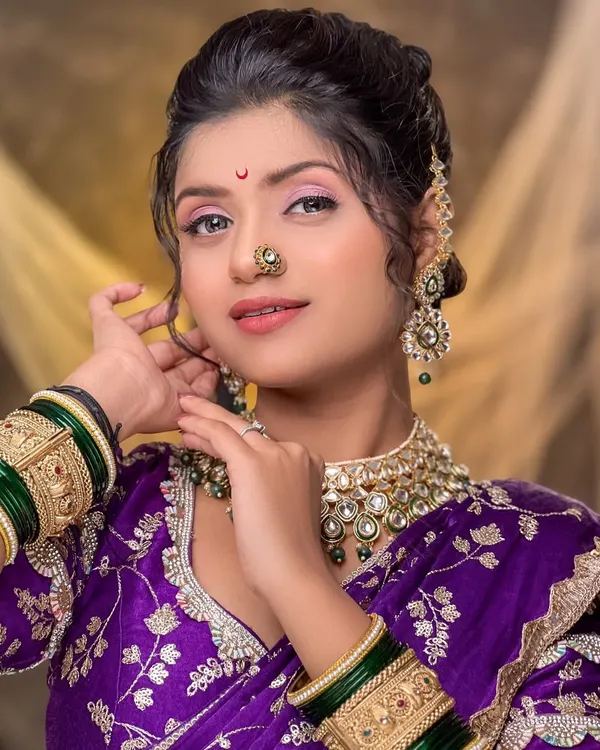 This is the quintessential Maharashtrian look I love to create. The soft, glowing makeup complements the rich purple saree and traditional jewelry, making it perfect for a wedding or special family function. Notice the flawless base and the way the eyes are defined without being overpowering.