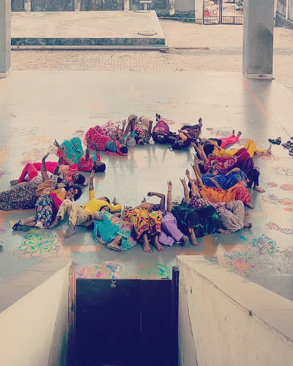 This is what community looks like. In my workshops, we become the art. Here, participants of the Haan Hum collective form a human rangoli, a living circle of celebration and solidarity. This is not about perfect lines; it is about connection.