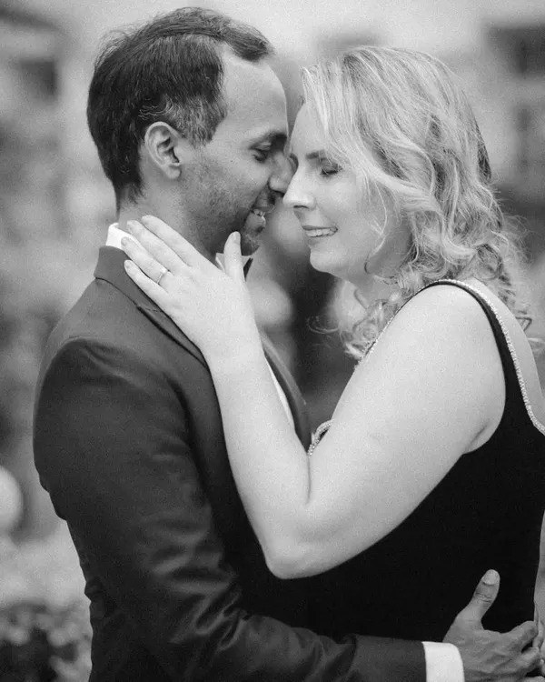 A classic, romantic black and white portrait. This intimate pre-wedding photo focuses on the close connection and quiet affection between the couple, creating a timeless and heartfelt image.