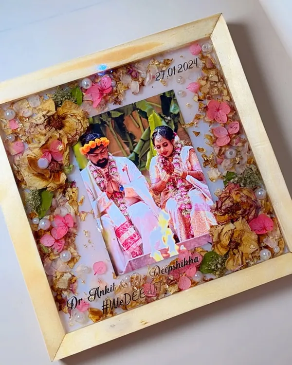 This is one of my favorite ways to preserve wedding memories. I take your beautiful varmala and a special photo, and seal them forever in this classic pine wood frame, creating a piece of art you can cherish daily.