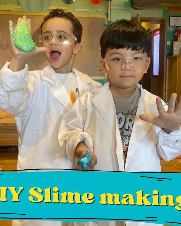 Welcome to the lab, where two young scientists are thrilled with their DIY slime creation. This is one of our most popular experiments, teaching chemistry in the most hands-on way possible.