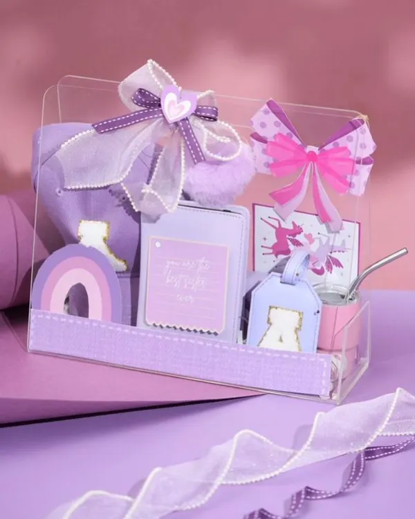 Our 'Princess Treatment' hamper in a lovely shade of purple. This box is filled with personalized items like a cap, a luggage tag, and other cute accessories for a little sister.