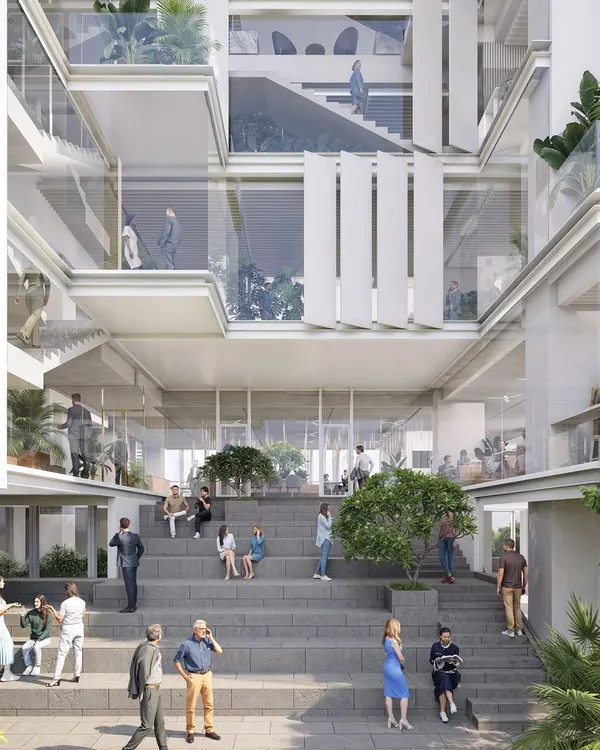 We believe the soul of a workspace lies in the spaces between, where informal connections are made and ideas flourish. This design for a modern office complex features a grand terraced plaza, creating a vibrant social heart for the building that encourages interaction and community.