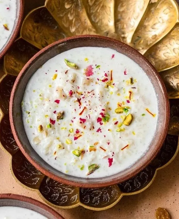 Muttanjan is a traditional celebratory sweet rice dish, garnished with pistachios, saffron, and rose petals. It's a rich and fragrant dessert that adds a special touch to any menu.