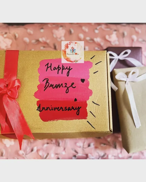 The beautifully hand-painted exterior of our "8 gifts for 8th anniversary" box. We call this the Bronze Anniversary, and the individually wrapped gifts are waiting inside.