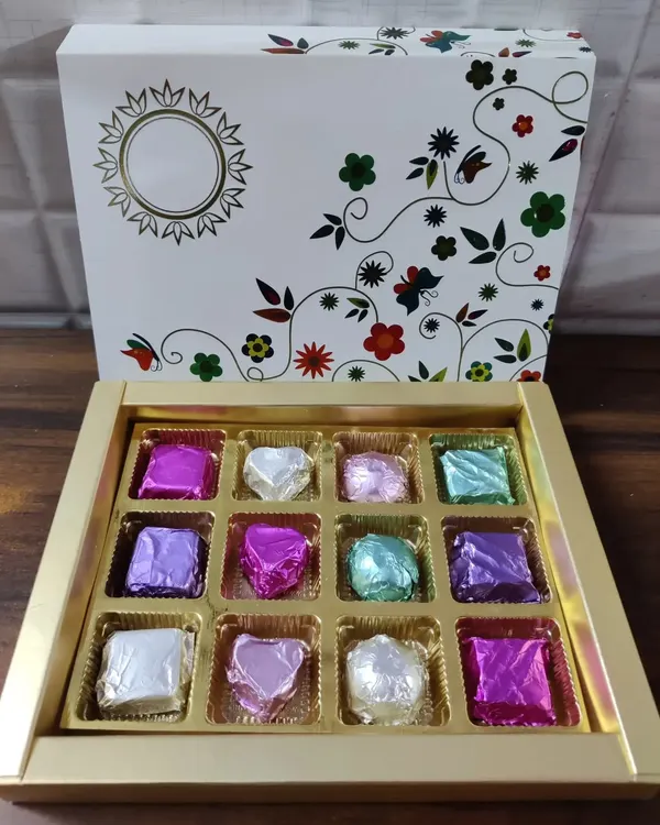This is my signature homemade chocolate gift box. It contains an assortment of hand-wrapped chocolates in a beautiful floral box, making it an ideal gift for festivals and birthdays.