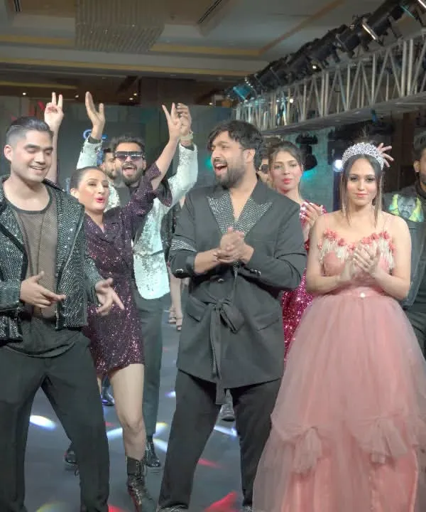 The final walk is always a celebration. Here I am on the ramp with my showstoppers and models after a successful show, soaking in the amazing energy from the audience.