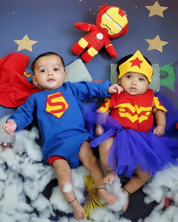 Double the fun with a superhero-themed twin photoshoot. Posing twins requires special care, and I love creating dynamic scenes like this one with Superman and Wonder Woman.