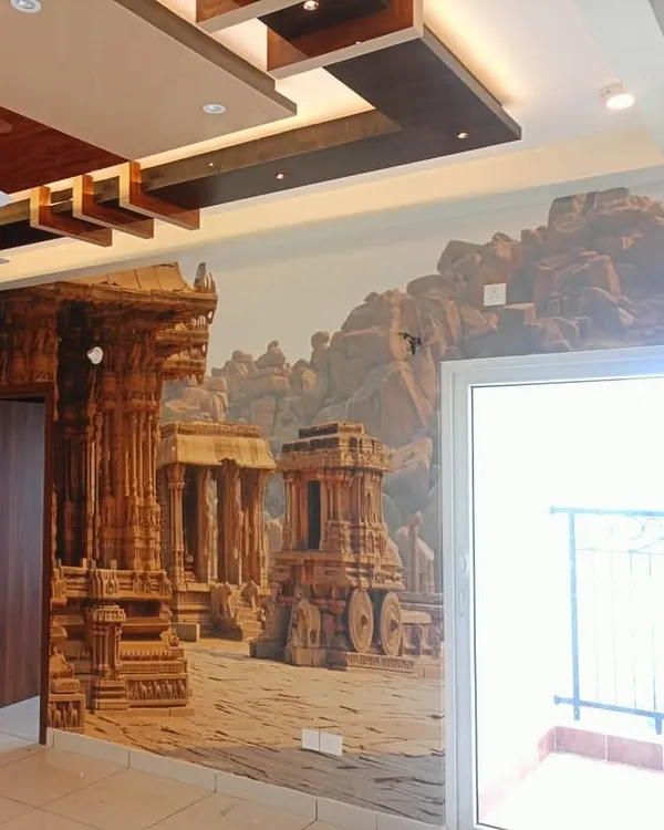 A grand Hampi-themed mural installed in a spacious living room. I carefully wrapped the design around the corner and door frame to create an immersive, panoramic view of the ancient ruins.