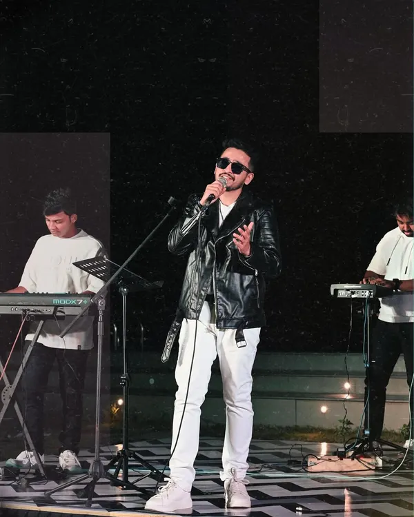 On stage with my band, lost in the music. This is my element, performing with a full live setup including keyboards and percussion, creating a rich and powerful sound.