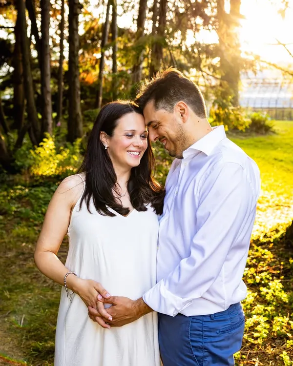 A tender moment between partners during their sunset maternity shoot. The warm light filtering through the trees created such a romantic and intimate atmosphere for their pregnancy portraits.