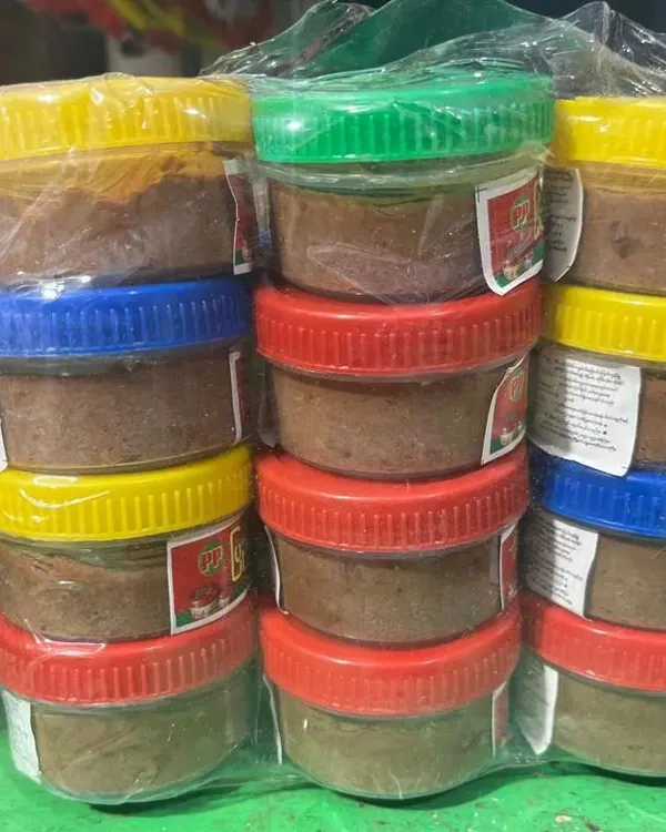 These are jars of my authentic Manipuri fermented fish paste (ngari), ready for sale. I ensure it's the real, potent version used in traditional home cooking.