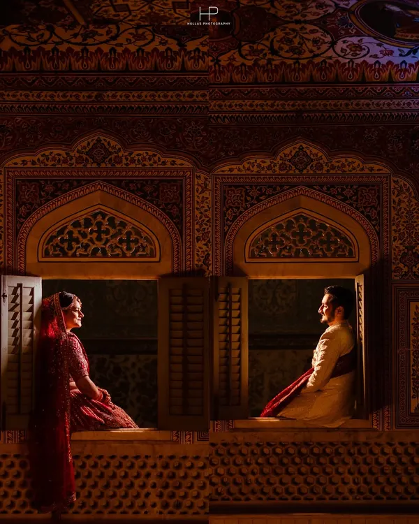 A portrait from a destination wedding in Samode, using the palace's intricate architecture to frame the couple. This is an example of my cinematic style, creating a moment that feels like it's straight out of a film.