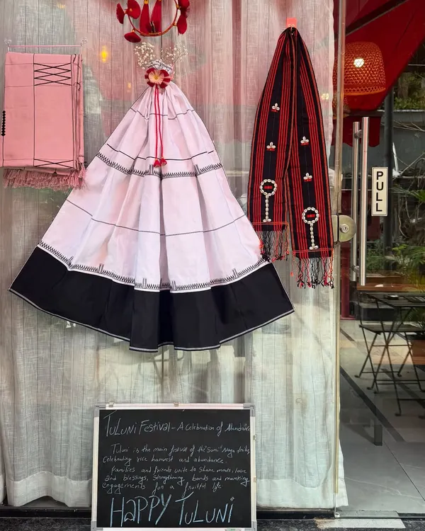 Our decorations for the Tuluni festival, a celebration of harvest and kinship for the Sumi Naga tribe. We displayed traditional garments and a small board explaining the festival's meaning.
