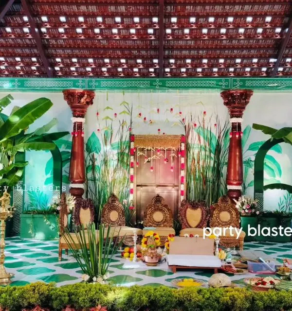 I specialize in creating authentic South Indian muhurtham stages that honor tradition. This setup features lush banana plants, classic wooden pillars, and brass lamps to create a sacred and beautiful space for your main ceremony.
