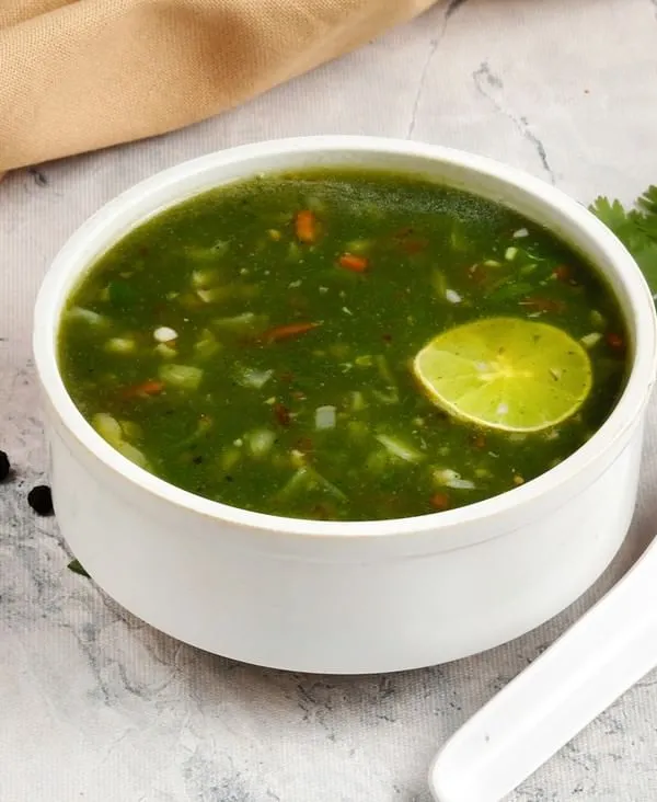 Our light and tangy Lemon Coriander Soup. This clear soup is packed with fresh coriander and a zesty lime flavour, making it a refreshing start to your meal.