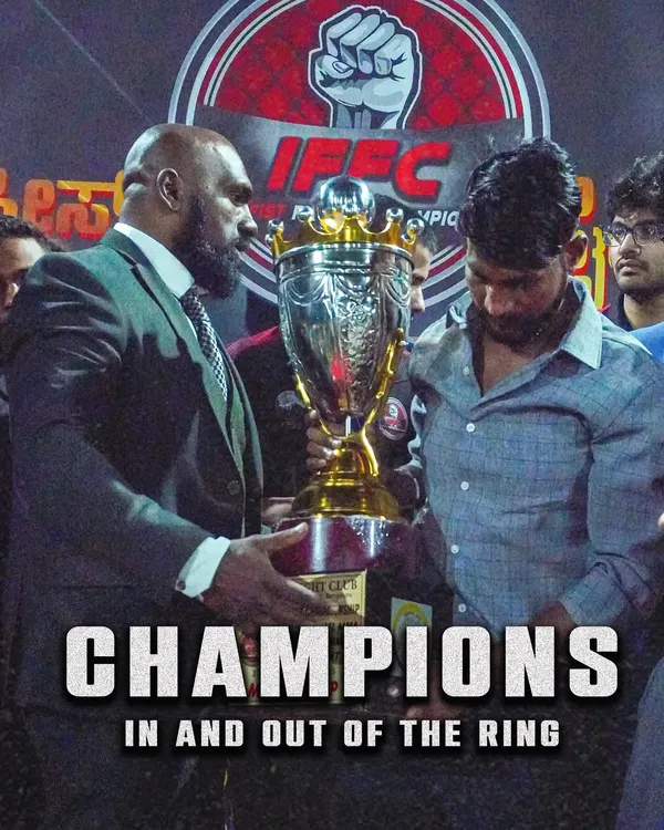 Champions in and out of the ring. Here I am awarding a trophy at our own Iron Fist Fighting Championship, an event we created to give fighters a platform to showcase their skills.
