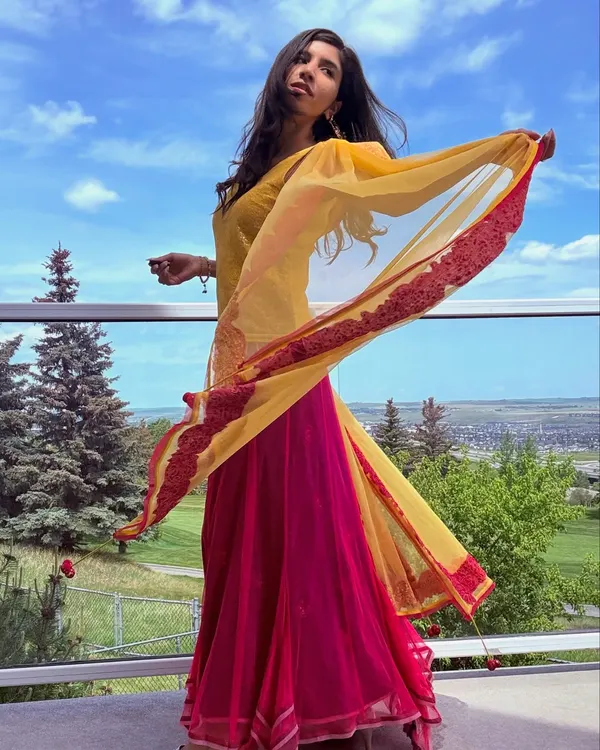 A photo capturing a feeling of being unfettered and sky-high. The movement in my dupatta reflects the freedom I feel when I dance.