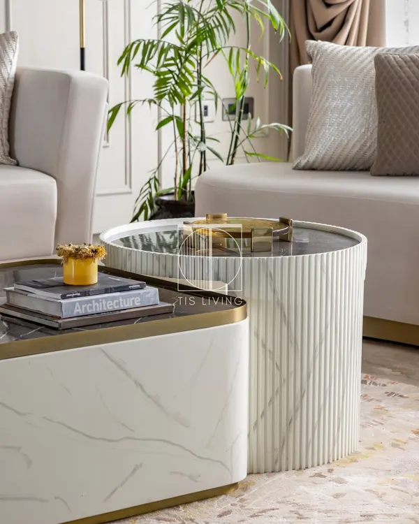 This fluted coffee table is a quiet showstopper. The hand-painted marble texture, soft curves, and golden accents create a piece where craftsmanship meets calm.