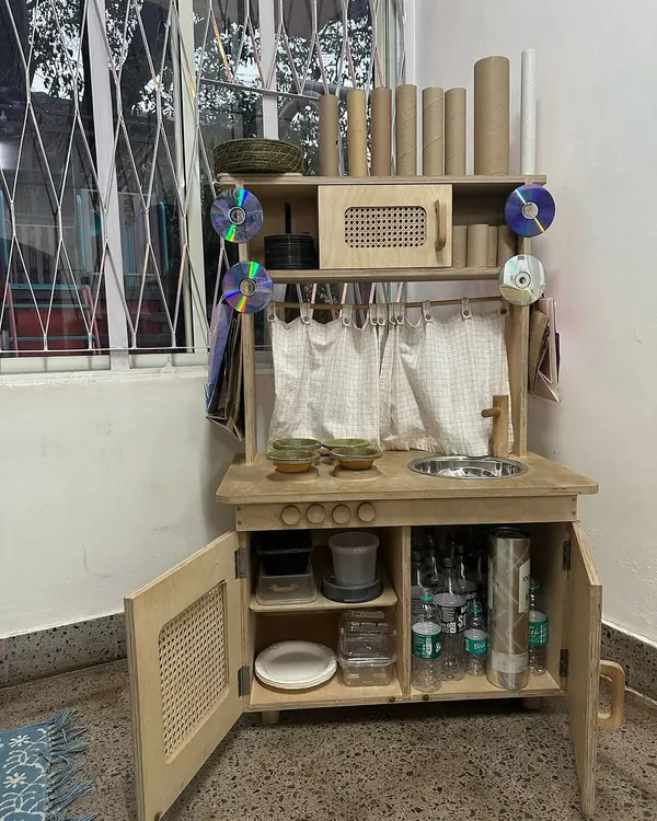 Welcome to the Playmaker's Lab, our end-of-year tradition. We pack away the toys and replace them with recycled treasures like cardboard, bottle caps, and fabric, inviting children to reimagine waste and create with purpose.
