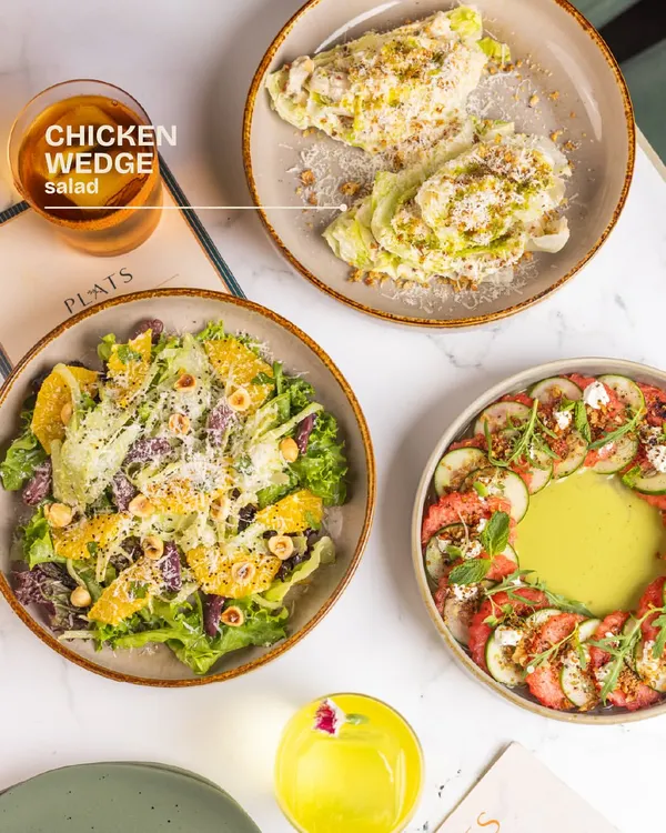 A trio of our seasonal salads. This one highlights the Chicken Wedge Salad, a crisp and refreshing option.
