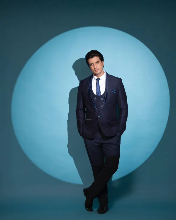 Styling actor Gashmeer Mahajani in a sharp, three-piece navy blue suit. This look is perfect for a formal reception or cocktail event, exuding confidence and modern sophistication.