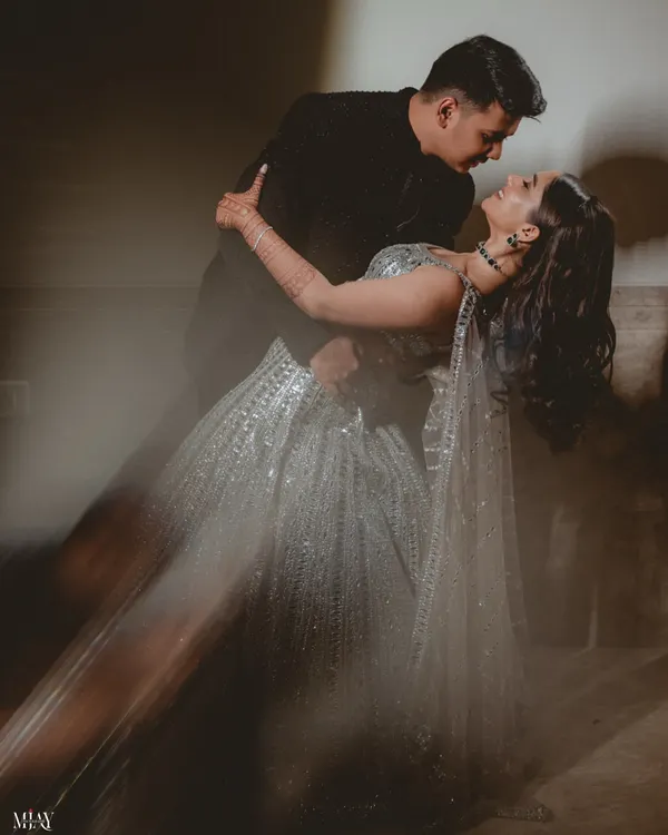 A dramatic dip on the dance floor, using motion blur to capture the energy and romance of this Sangeet performance.