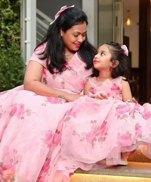 A sweet moment between a mother and daughter in their matching floral gowns. I love seeing my clients enjoy their special outfits together.