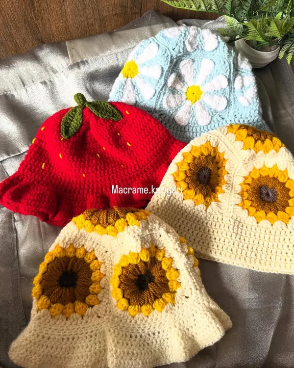 We offer a variety of crochet bucket hat designs, including the popular strawberry, daisy, and sunflower patterns. Each one is handmade with breathable yarn, making them a fun and stylish accessory for sunny weather.