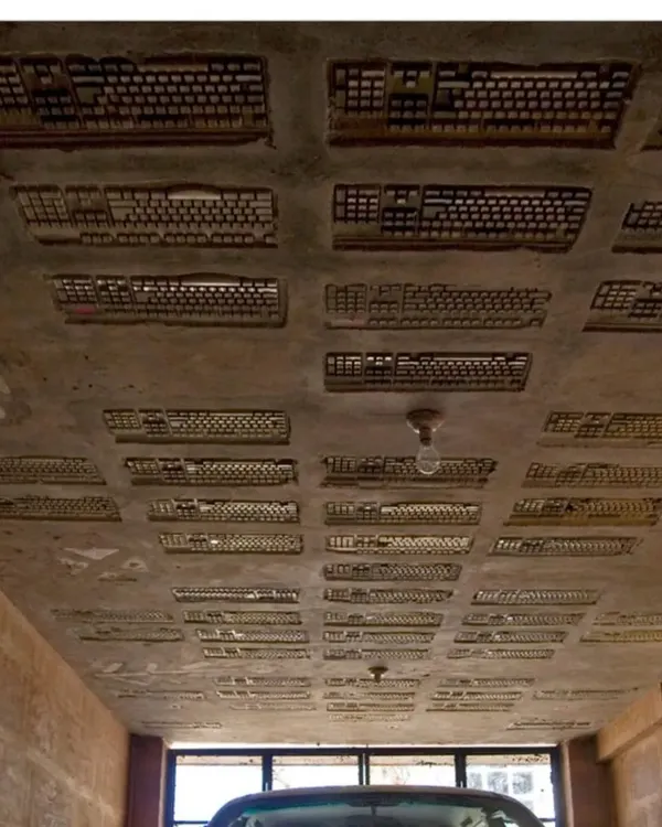 The ceiling of the car park at the Professor's Residence, made by embedding discarded computer keyboards into the concrete slab. This is one of our favorite examples of creative upcycling, turning e-waste into a unique textural element.