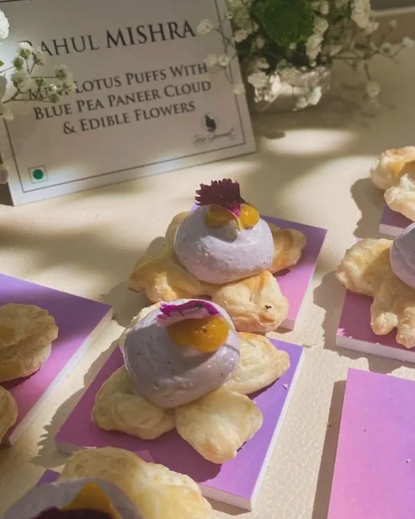 As delicate as couture embroidery. These mini lotus puffs with a bluepea paneer cloud and edible flowers were created for fashion designer Rahul Mishra's store launch. We love designing food that perfectly matches the theme and elegance of an event.