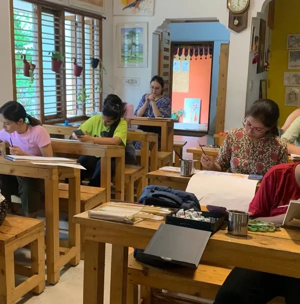A wide view of our classroom shows the heart of our Gurukul. Here, students of all ages sit together, each on their own artistic path but united by a shared passion for learning and creating.