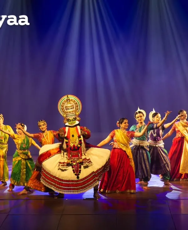 A full cast performance of 'Colours of India', featuring a central Kathakali dancer. This production is a vibrant tapestry of classical, folk, and martial dance forms from across the country.