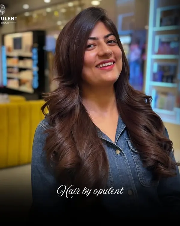 A beautiful example of a layered haircut combined with a rich, warm brown color. The final style has incredible volume and movement.