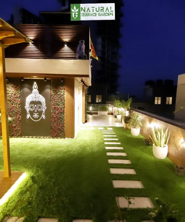 The Gwal Pahari terrace at night. Our lighting design highlights the pathway, the feature wall, and the plants, creating a serene and beautiful atmosphere.