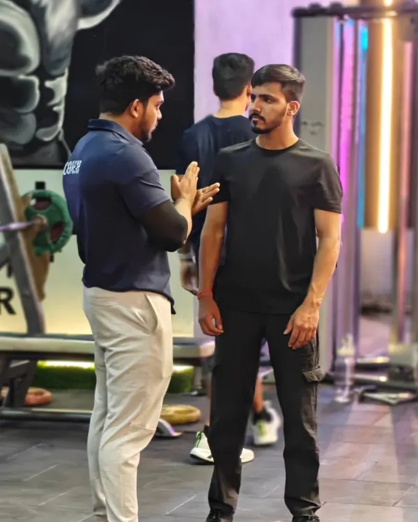 Communication is key. A coach takes the time to explain the mechanics of an exercise to a client, ensuring they understand the movement before they even lift.