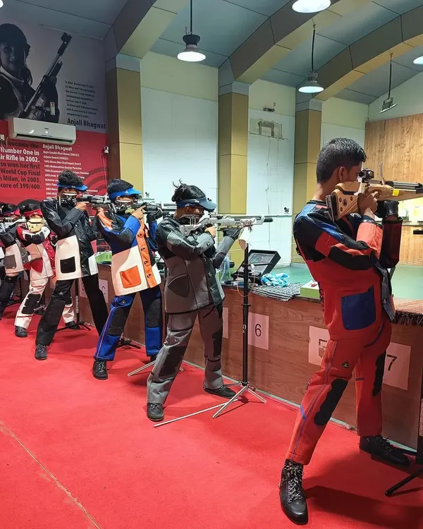 A line of my shooters in perfect formation, aiming down the range. This image captures the synergy and discipline that is a hallmark of our daily training sessions.