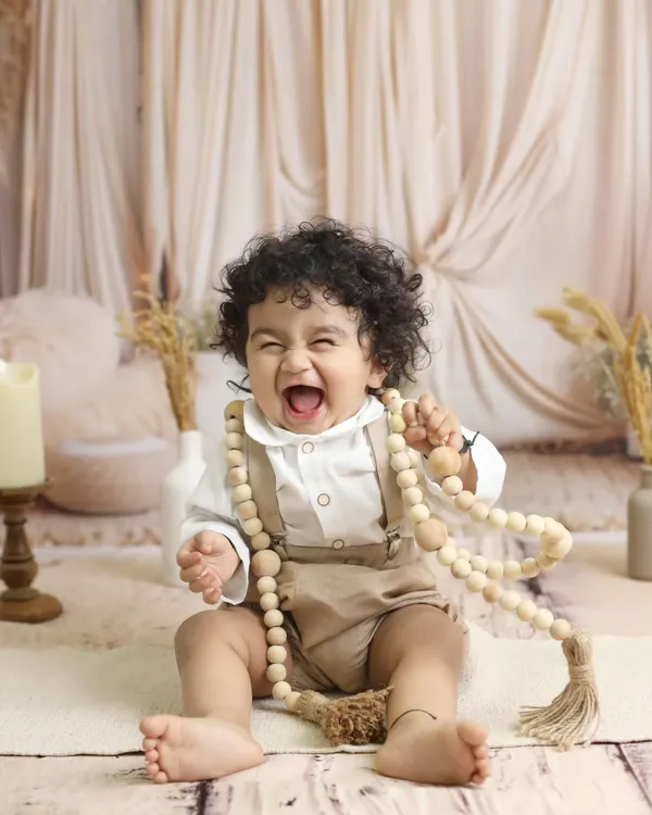We believe the best portraits capture genuine emotion. This beautiful, natural light session with a rustic boho theme is all about capturing that pure, uninhibited laughter that you'll want to remember forever.