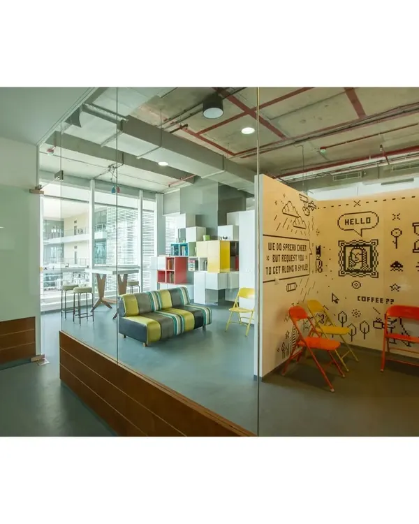 For the 8-Bit office, we created this fun breakout space. The doodle wall and colorful chairs provide a relaxed contrast to the main work areas, giving the team a place to unwind and chat.
