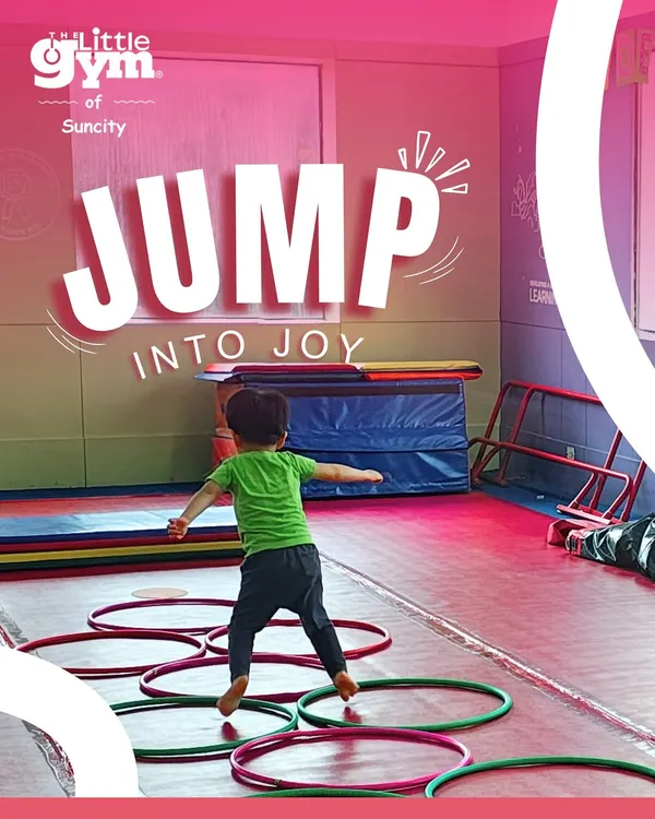 This is what it's all about: jumping into joy! Here, a child navigates a fun obstacle course with hoops, building coordination and having a great time.