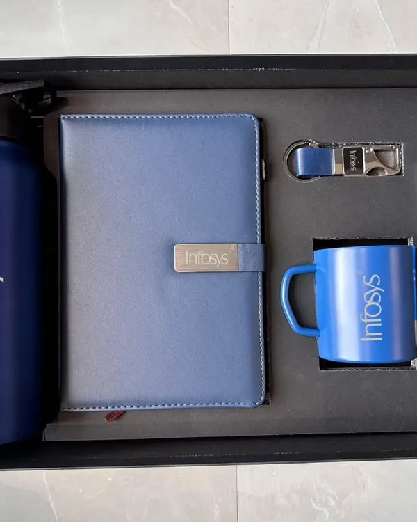 A complete corporate gift set I created for Infosys. This blue-themed combo includes a branded 750 ML bottle, A5 diary, steel mug, pen, and keychain, all neatly presented in a premium box.