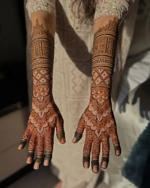 A complete bridal look, this design extends up the arms with symmetrical patterns. I use fine lines and detailed fillers to create a stunning effect that looks beautiful both in person and in photos.