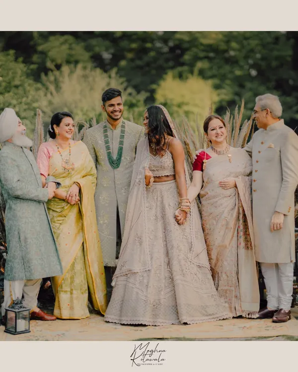 A beautiful family portrait from a wedding shoot we styled and conceptualized. We chose a coordinated color palette of ivory, beige, and soft metallics to create a look of understated elegance for the entire family.
