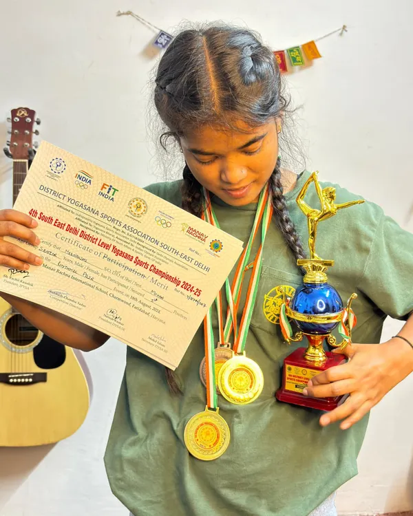 So proud of my student showing off her trophy and medals from the District Yogasana Sports Championship. Her hard work and dedication are truly inspiring.