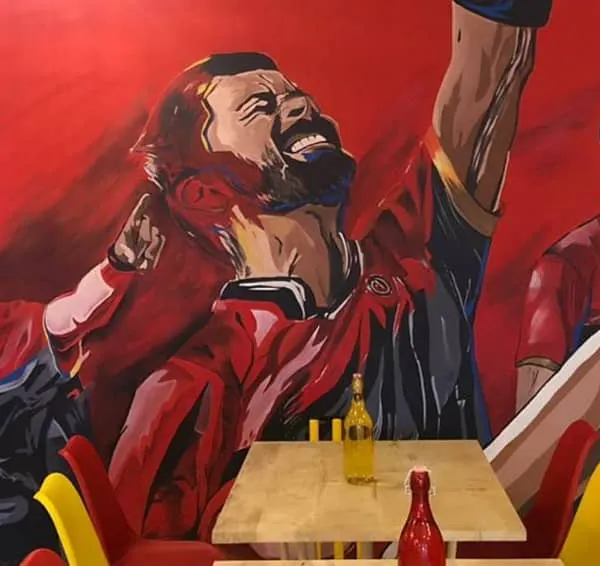 This massive mural for the Ee Sala Cup Namde Cafe is a tribute to our favorite team, RCB. We captured the raw passion of Virat Kohli, Yuzvendra Chahal, and AB de Villiers to create an electrifying atmosphere for cricket fans.